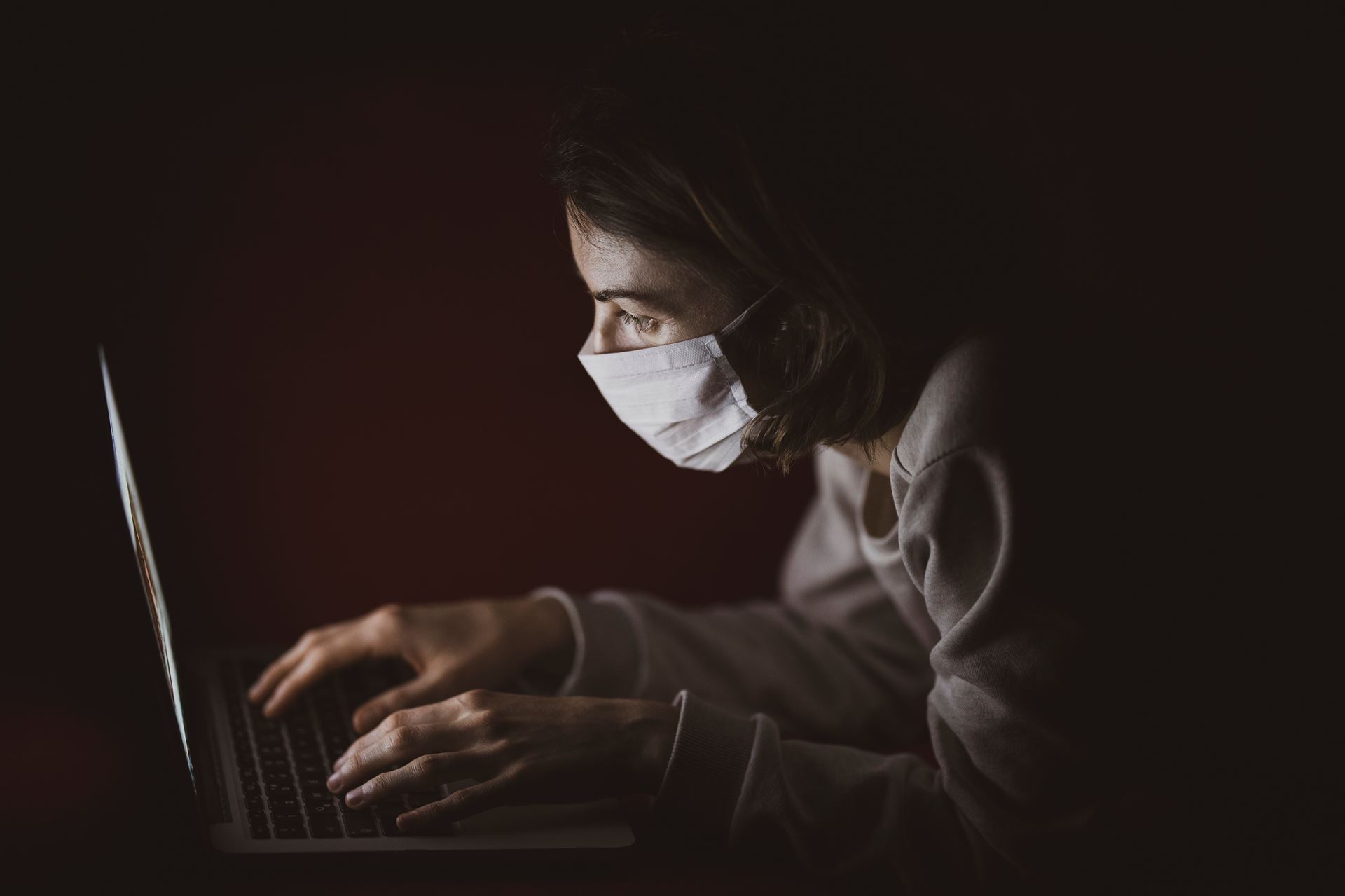 Masked person searching internet